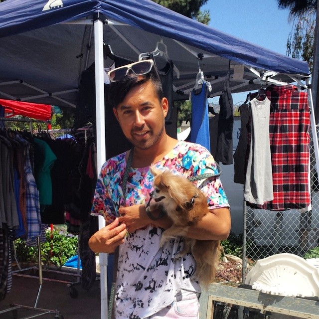 Clothing designer and #MTPfairfax vendor,  Pascual in Y8 is holding one of this clients, Devo!
