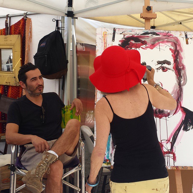Artist @JulieArnoff is painting her neighboring vendor, Miguel. What a talent! #MTPfairfax #LAartist